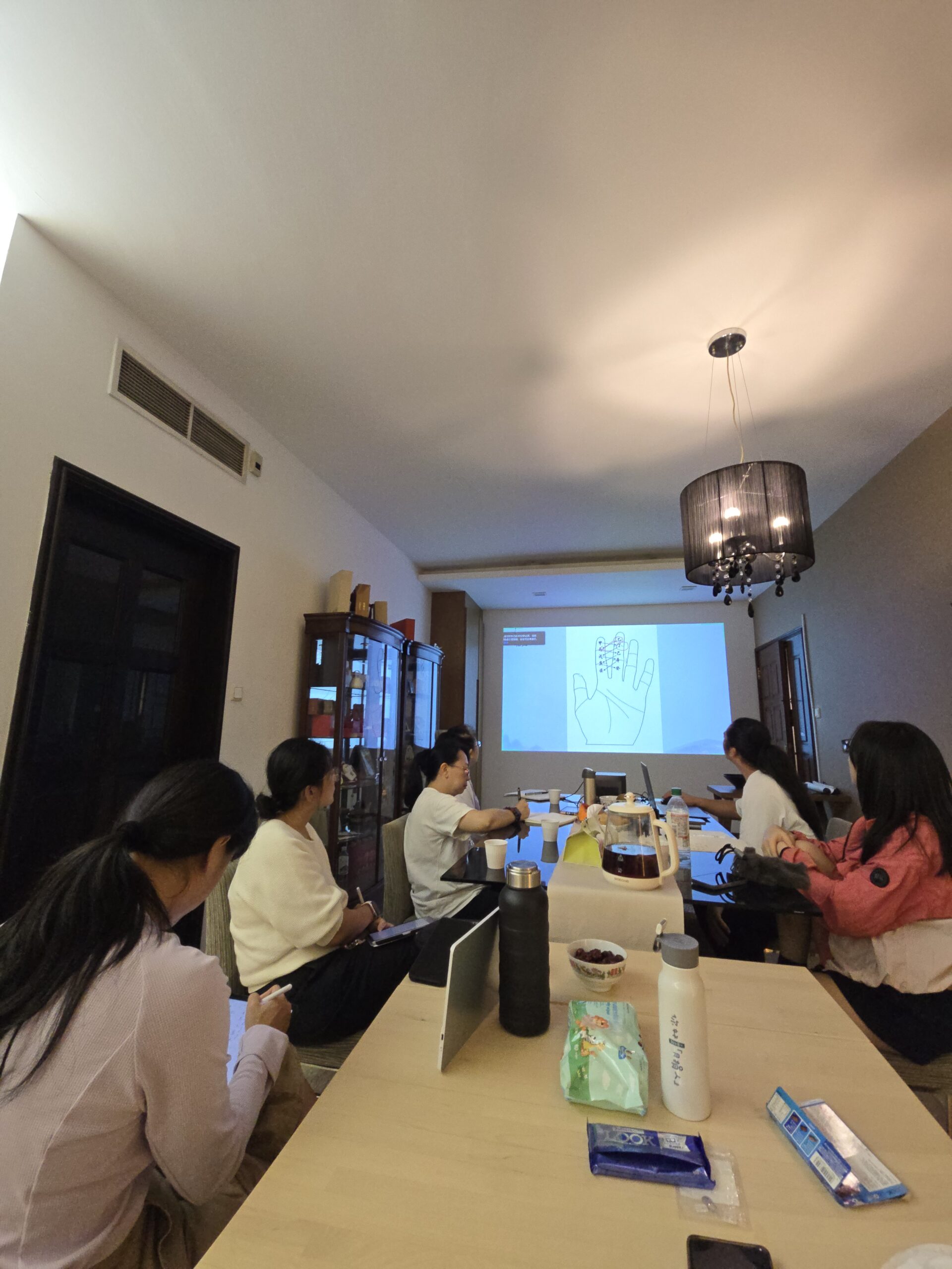Students learning Feng Shui principles during Feng Shui courses in Singapore