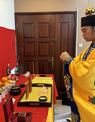 Man performing a Feng Shui Cleansing Ritual in a traditional setting